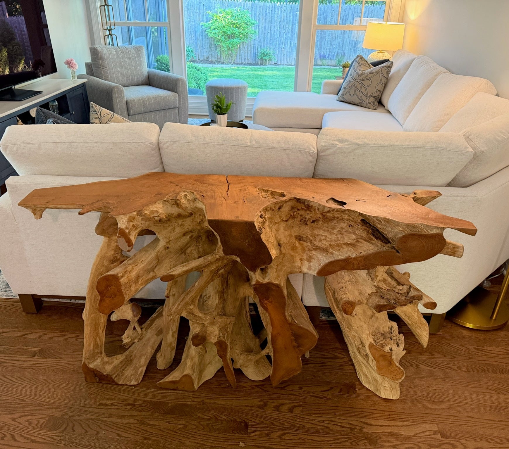 Wooden console table with natural design in a living room setting