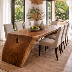 Dining room with a wooden table and chairs in a bright, modern interior.